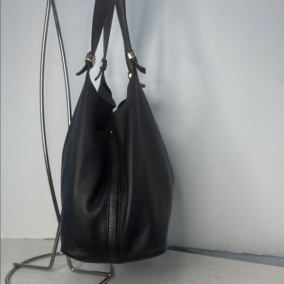 The image shows a Michael Kors Colgate Reversible Grab Bag in black. - Picture 3 of 11